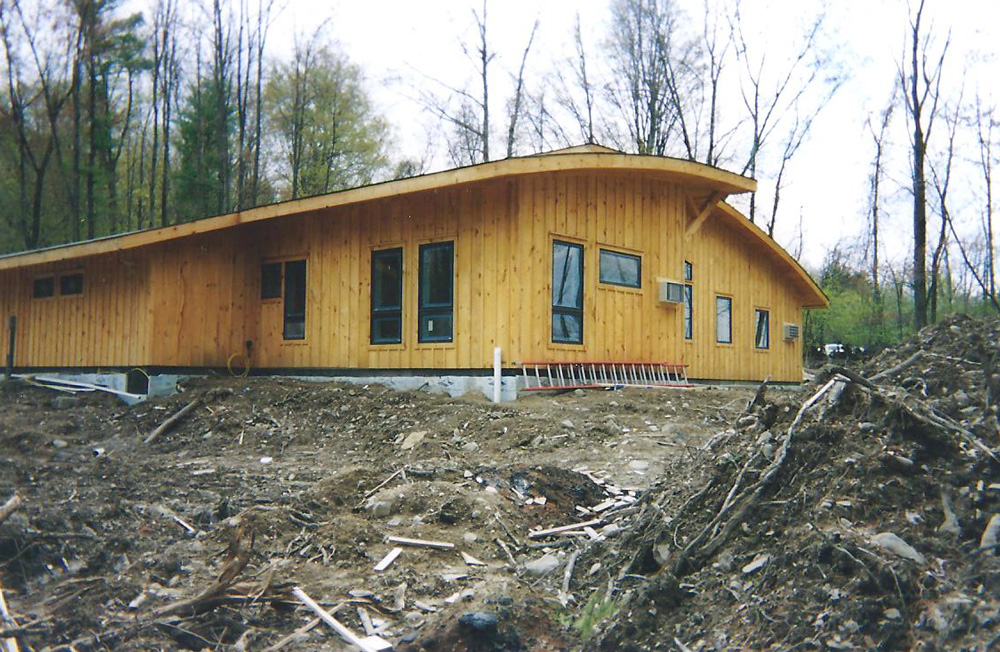 Modern wooden house with arched roof